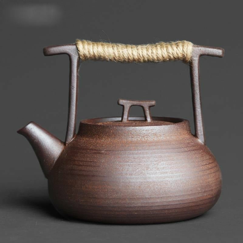 https://idealplacemarket.com/cdn/shop/products/handmade-ceramic-teapot-with-eye-catching-style-rope-wrapped-handle-coffee-servers-tea-193.jpg?v=1665467759